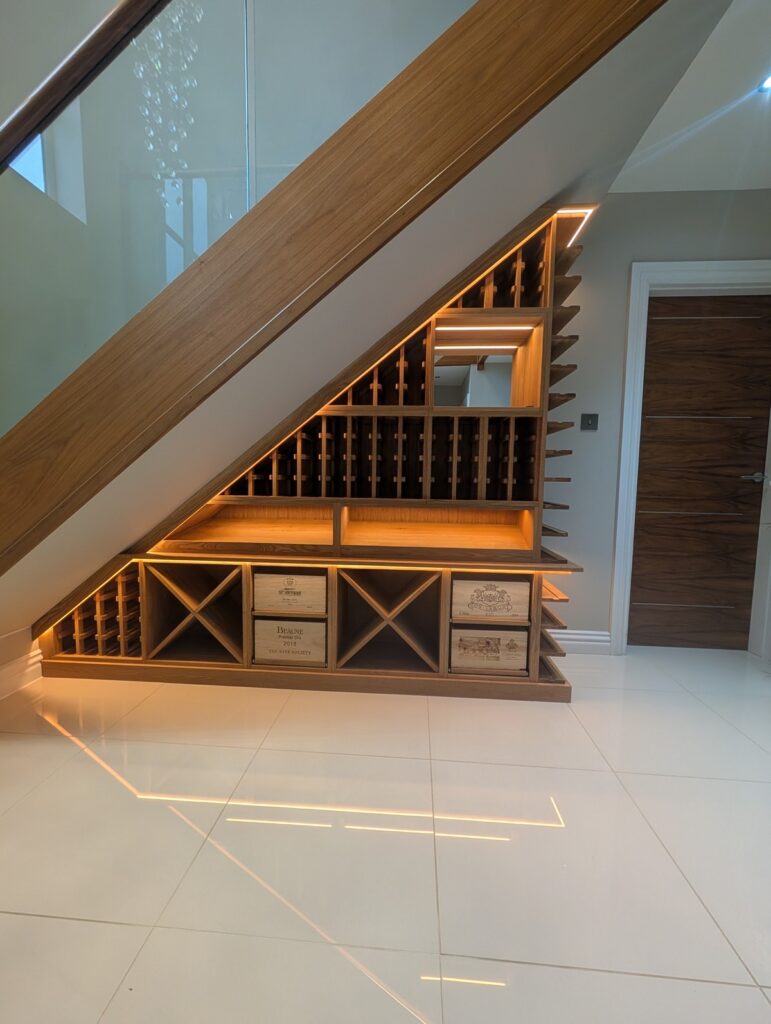 stunning under stairs wine storage solution